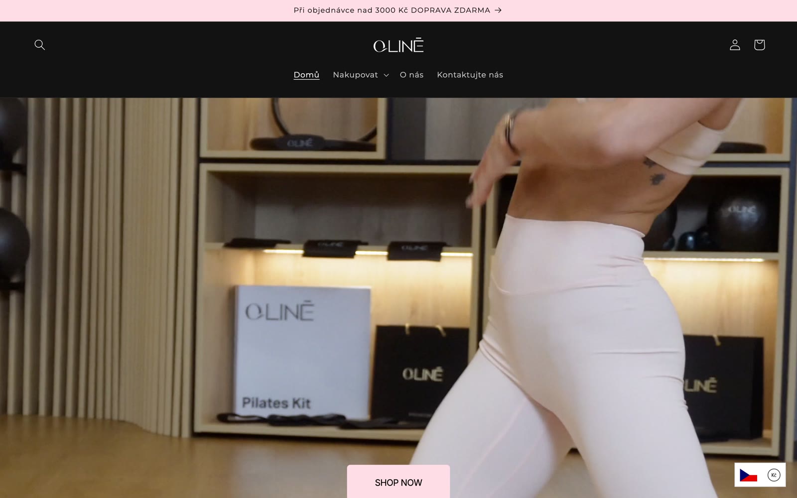 The QLINE storefront: a pilates studio scene with branded shelving and a soft pink call to action